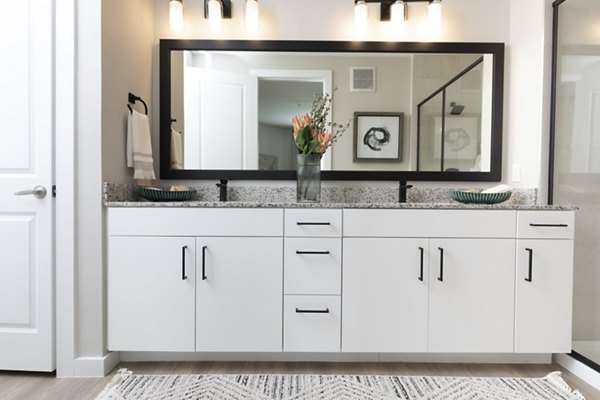 Bathroom featuring sleek modern fixtures at Eleve Apartments in Seattle