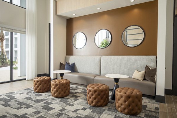 Spacious clubhouse with modern design at Eleve Apartments, ideal for social gatherings and leisure activities