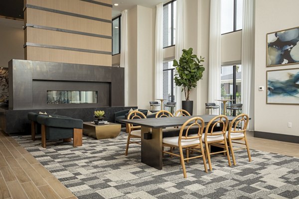 Elegant clubhouse with contemporary decor at Eleve Apartments offering modern amenities for social gatherings