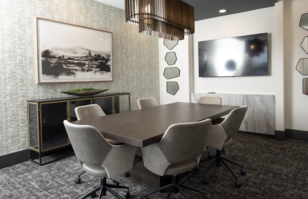 Business center with ergonomic workstations at Eleve Apartments