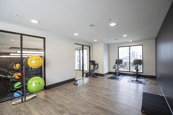 State-of-the-art fitness center with modern equipment at Eleve Apartments, perfect for active lifestyles and wellness enthusiasts