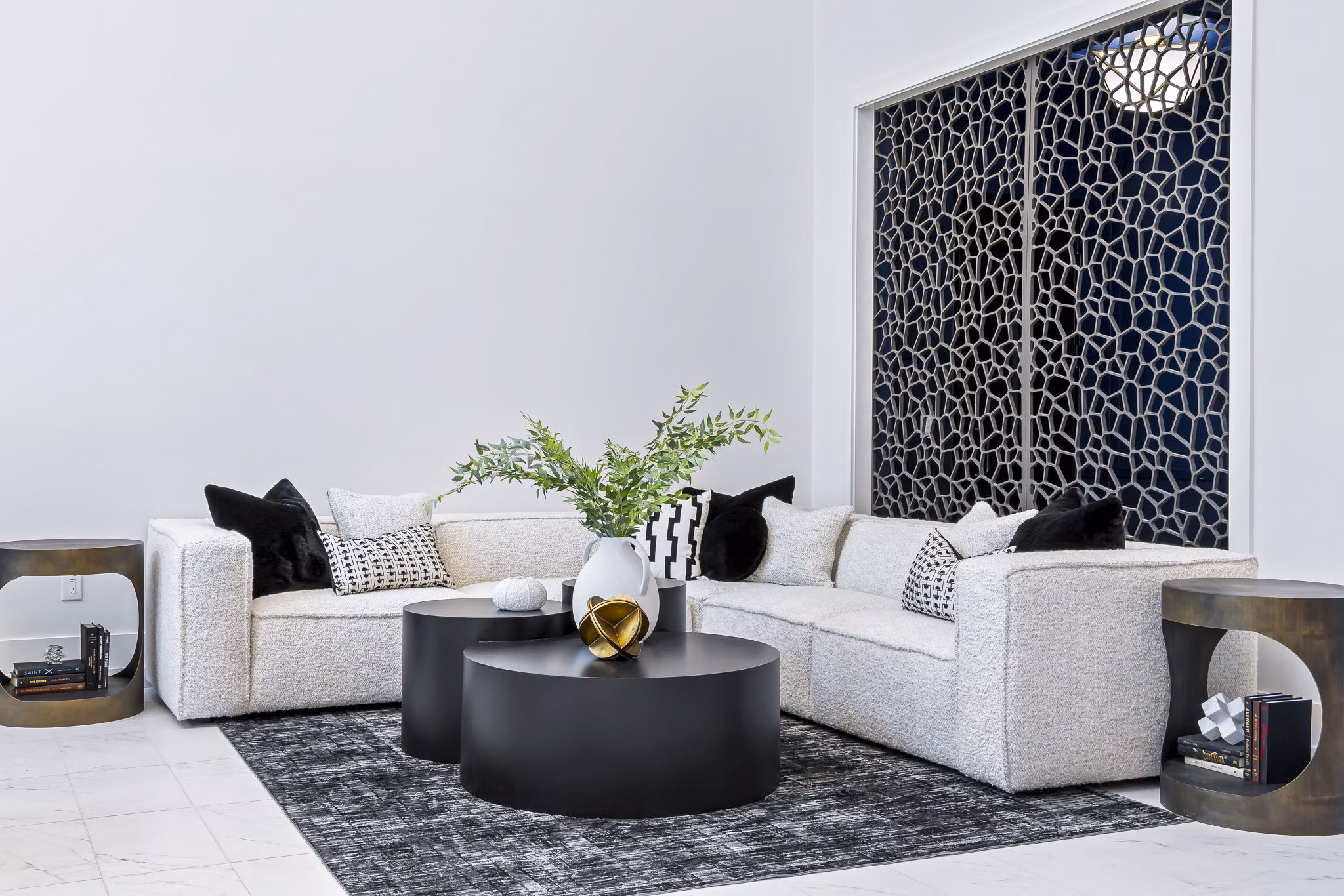 The Keaton at Brier Creek Apartments: Modern clubhouse lobby with cozy seating and bright lighting for social gatherings