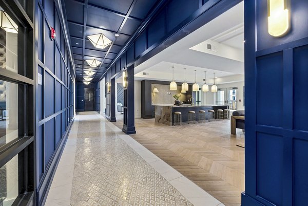 The Keaton at Brier Creek: Modern clubhouse lobby with cozy seating areas and elegant decor in luxury apartments
