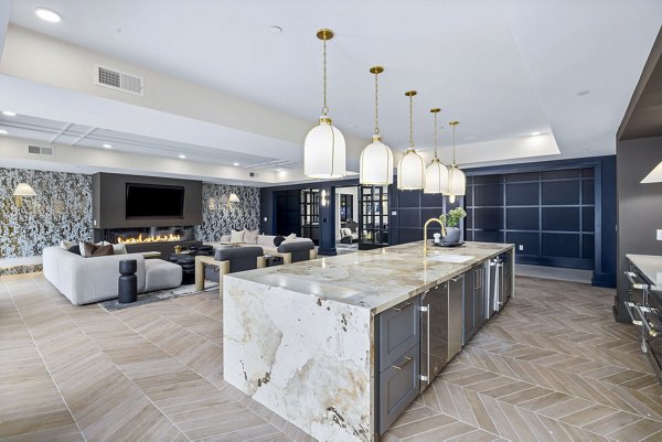 Clubhouse lobby with modern furnishings at The Keaton at Brier Creek Apartments, featuring luxury finishes and comfortable seating areas