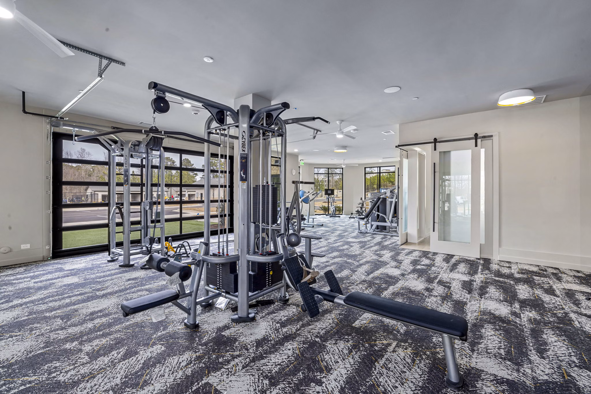 Modern fitness center with state-of-the-art equipment at The Keaton at Brier Creek Apartments