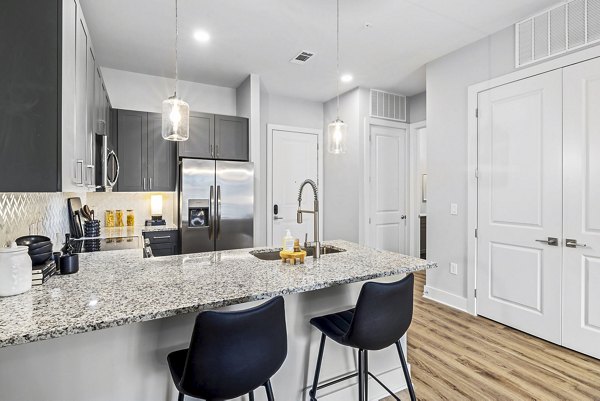 Spacious kitchen with stainless steel appliances at The Keaton at Brier Creek Apartments
