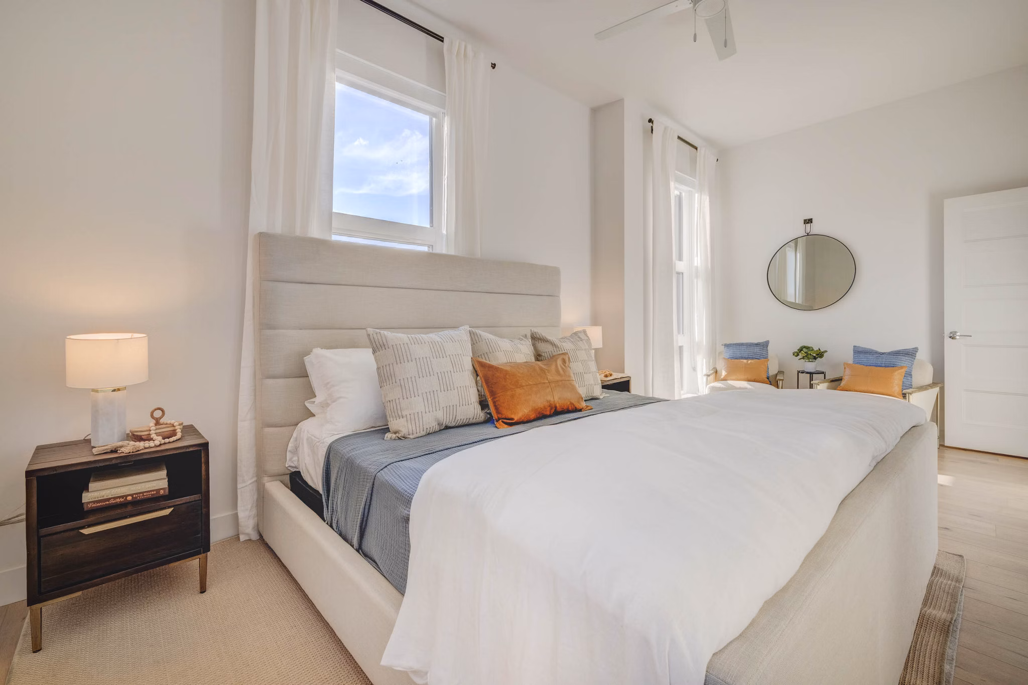 Bedroom with contemporary design featuring large window views in Camber Apartments, Greystar luxury community