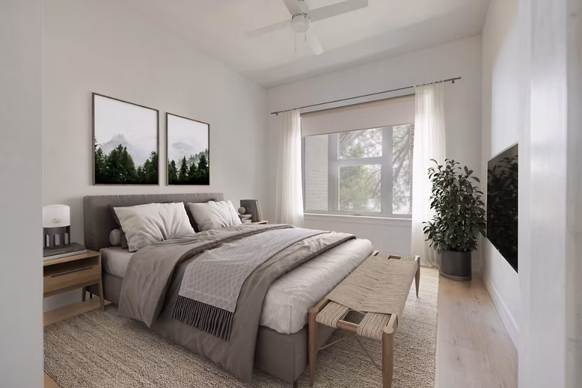 Cozy bedroom with modern decor and ample natural light at Camber Apartments, luxury living experience in Greystar luxury apartments