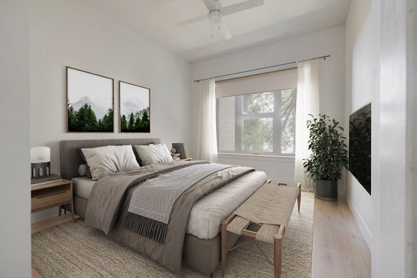Cozy bedroom with modern decor and ample natural light at Camber Apartments, luxury living experience in Greystar luxury apartments
