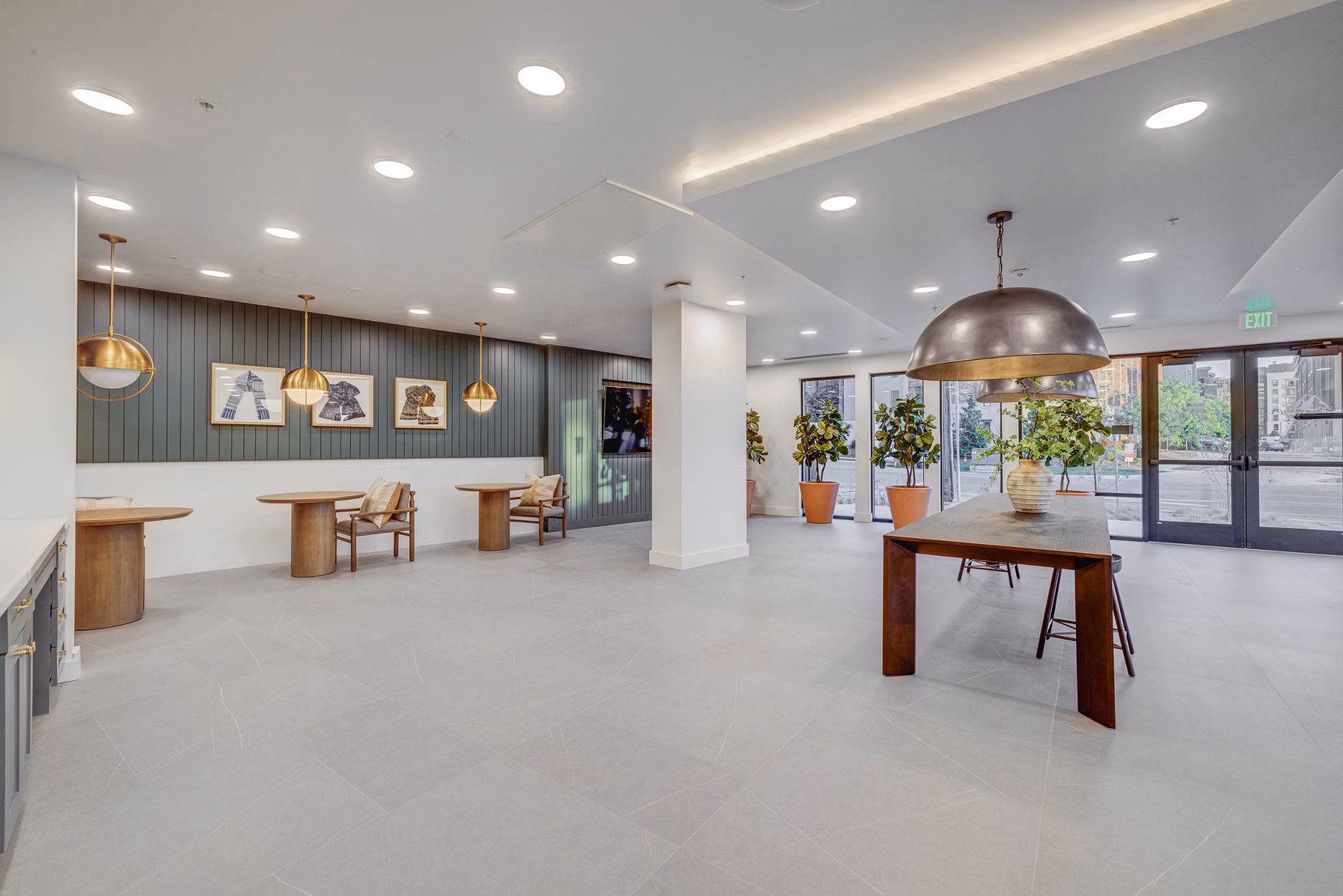 Spacious clubhouse with modern decor at Camber Apartments featuring versatile seating areas for community gatherings