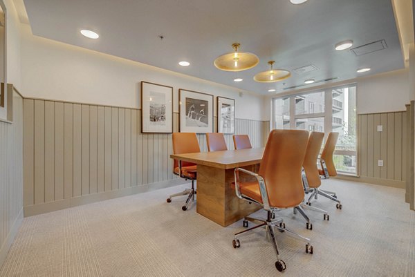 Clubhouse featuring modern decor and entertainment space at Camber Apartments