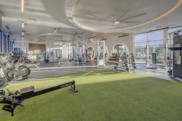 Fitness center with state-of-the-art equipment at Camber Apartments, offering luxury living and wellness amenities for active lifestyles