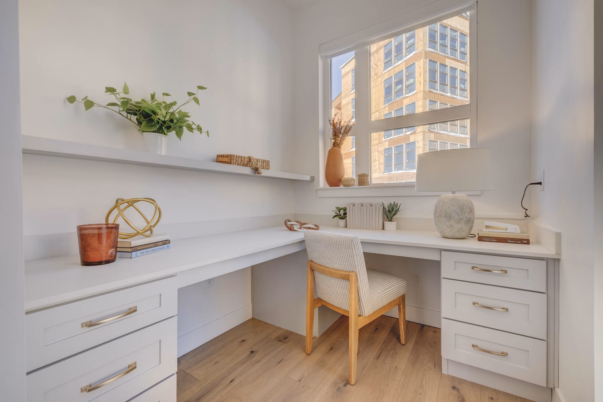 Open-concept kitchen with marble countertops at Camber Apartments