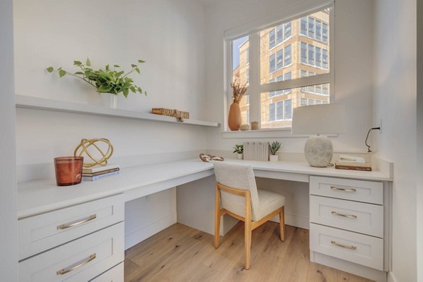 Open-concept kitchen with marble countertops at Camber Apartments