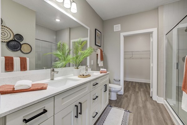 Luxurious bathroom with modern fixtures at Alton Serenoa Apartments