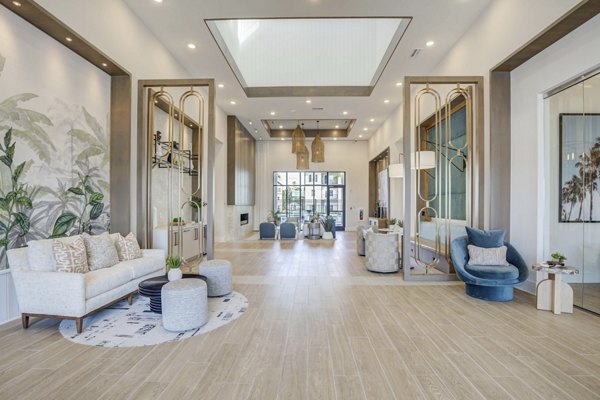 Modern clubhouse with stylish furnishings at Alton Serenoa Apartments offering luxury amenities for residents
