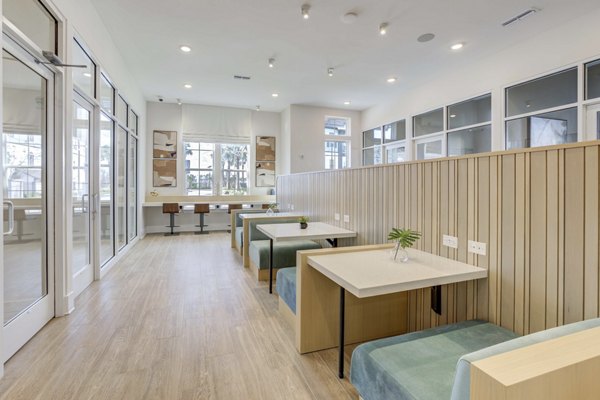 Clubhouse featuring modern design and comfortable seating at Alton Serenoa Apartments