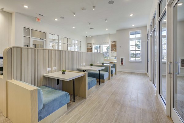 Clubhouse featuring modern furnishings at Alton Serenoa Apartments, a Greystar luxury community
