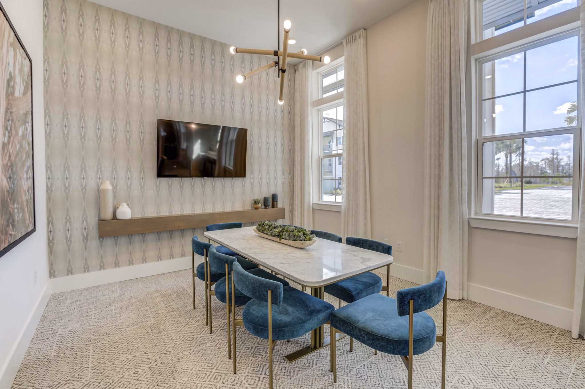 Meeting space with modern furnishings at Alton Serenoa Apartments, ideal for gatherings and professional events Luxury rental option in Greystar community