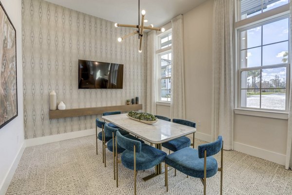 Meeting space with modern furnishings at Alton Serenoa Apartments, ideal for gatherings and professional events Luxury rental option in Greystar community