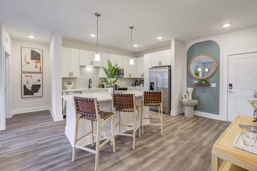 Modern kitchen with stainless steel appliances in Alton Serenoa Apartments