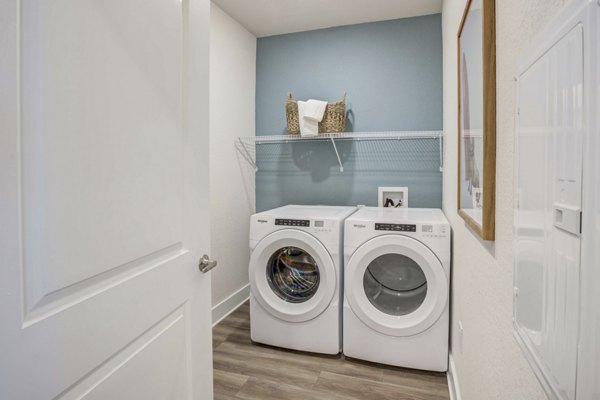 laundry room at Drexler Townhomes at Holbrook FarmsAlton Serenoa Apartments