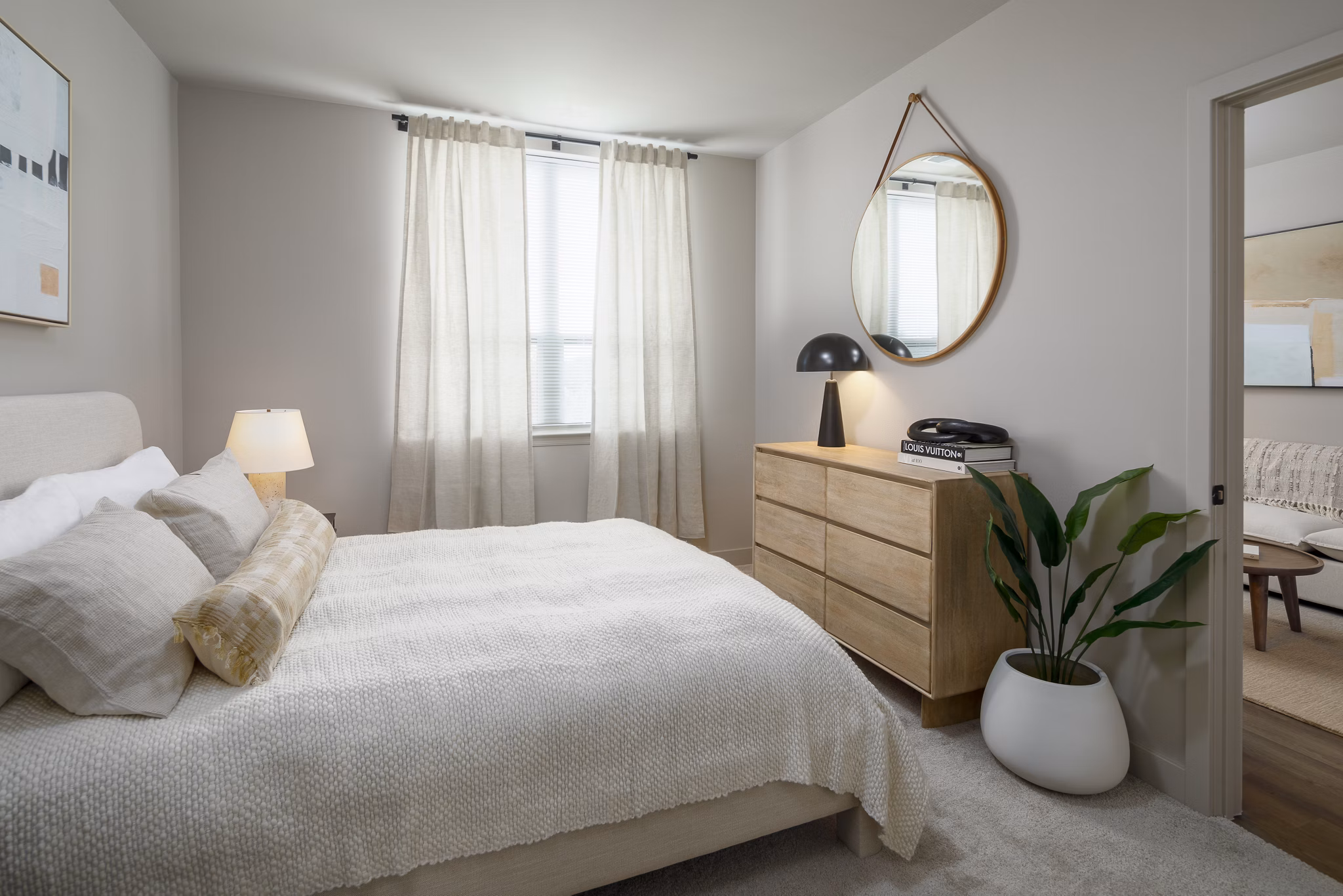 Cozy bedroom with minimalist decor at Atworth Apartments