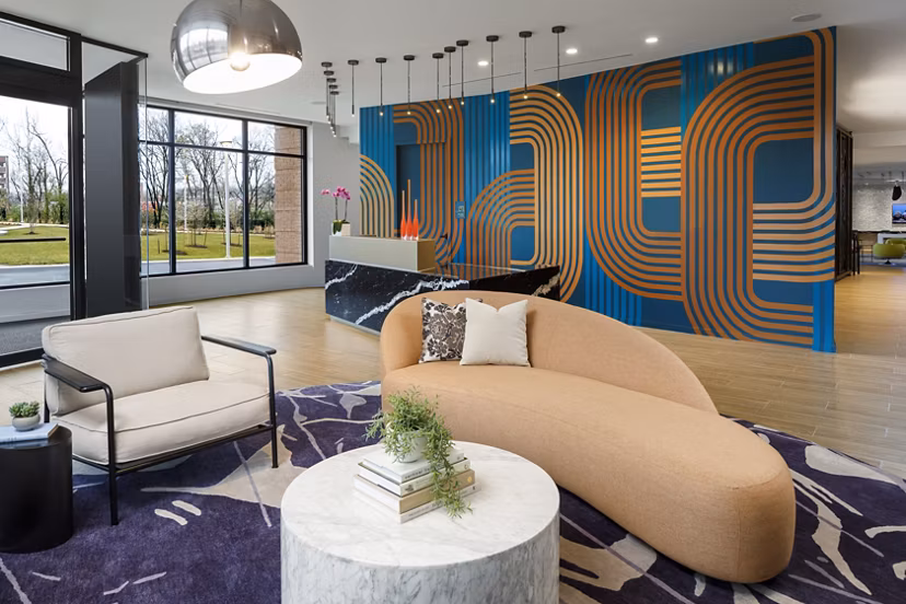 Clubhouse with modern design and comfortable seating at Atworth Apartments, ideal for social gatherings and relaxation