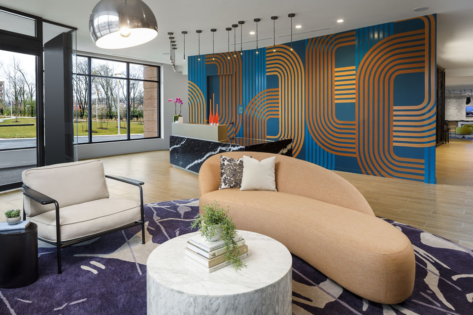 Clubhouse with modern design and comfortable seating at Atworth Apartments, ideal for social gatherings and relaxation
