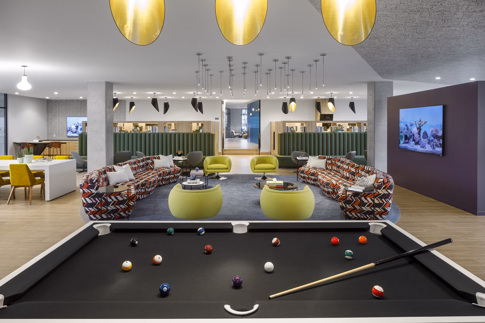 Clubhouse featuring modern decor and comfortable seating at Atworth Apartments, a Greystar luxury community