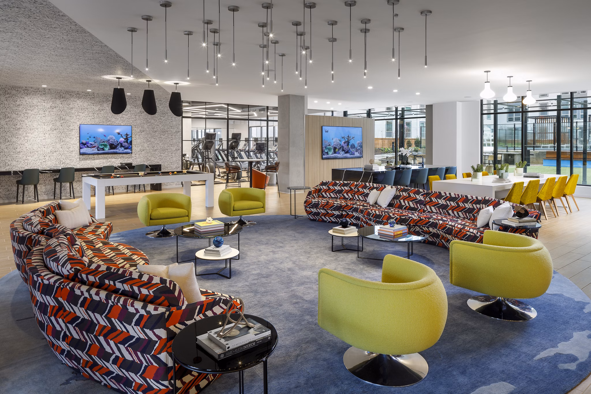 Stylish clubhouse featuring modern seating and entertainment options at Atworth Apartments