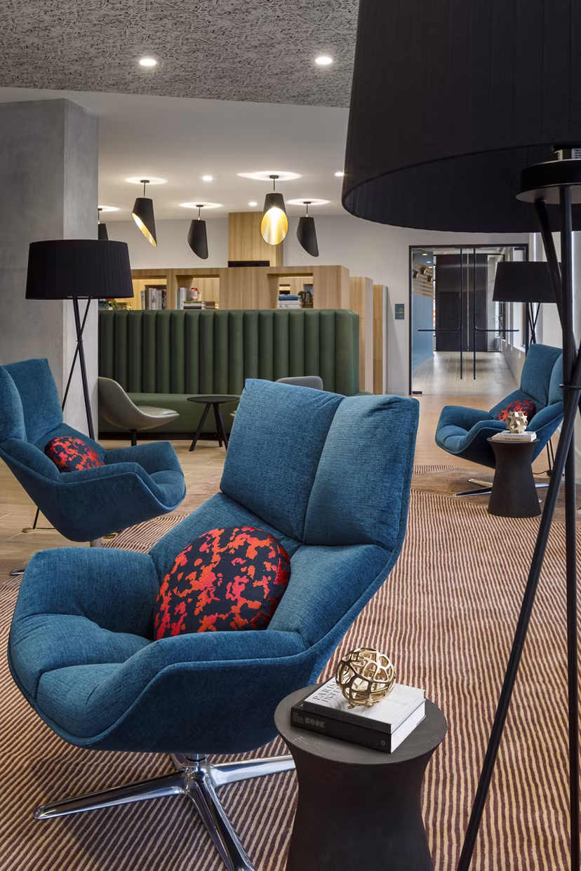 Clubhouse featuring modern design and cozy seating at Atworth Apartments