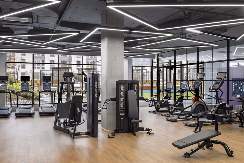 Modern fitness center with state-of-the-art equipment at Atworth Apartments for an active lifestyle