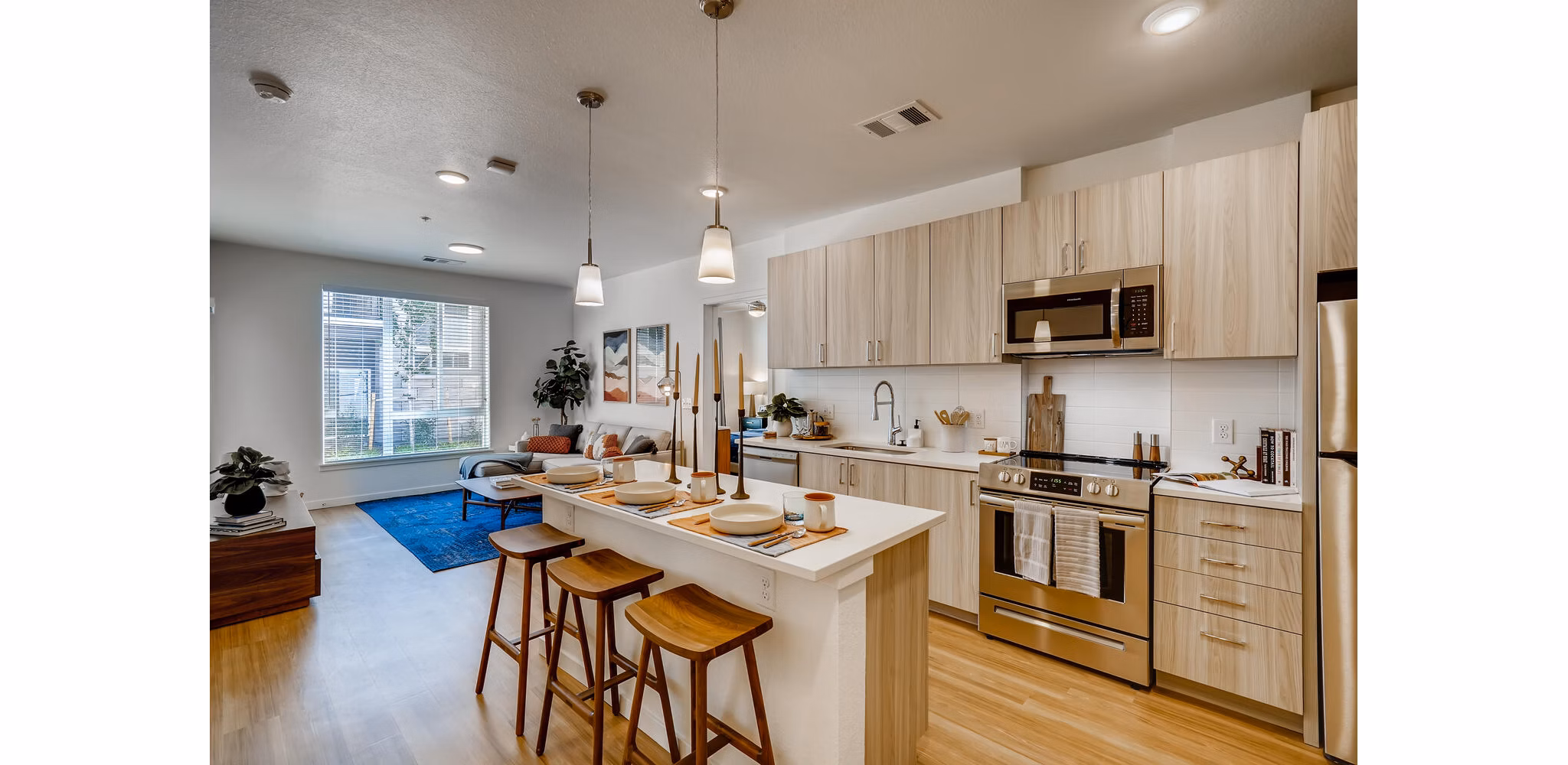 Modern kitchen with stainless steel appliances in Legacy at Fitz Apartments