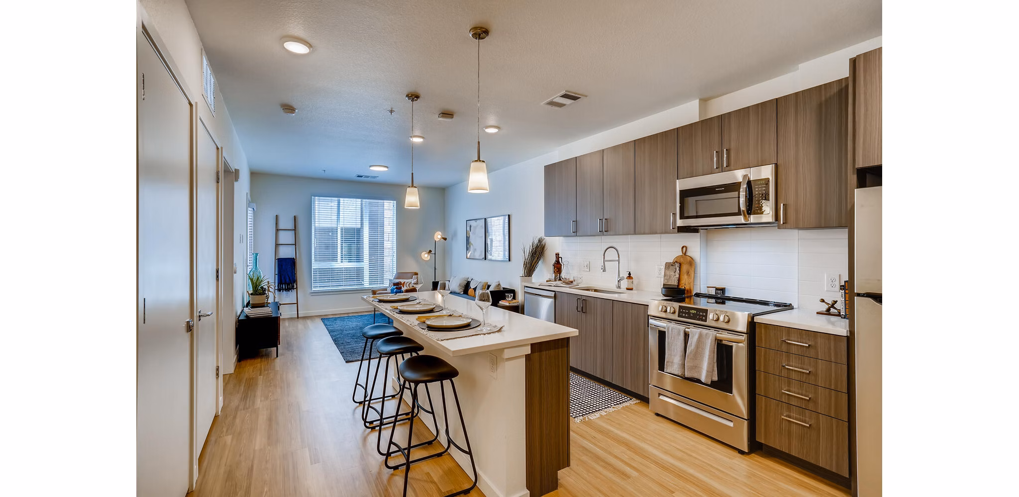 Modern kitchen with stainless steel appliances in Legacy at Fitz Apartments, combining functionality and style in a premium setting