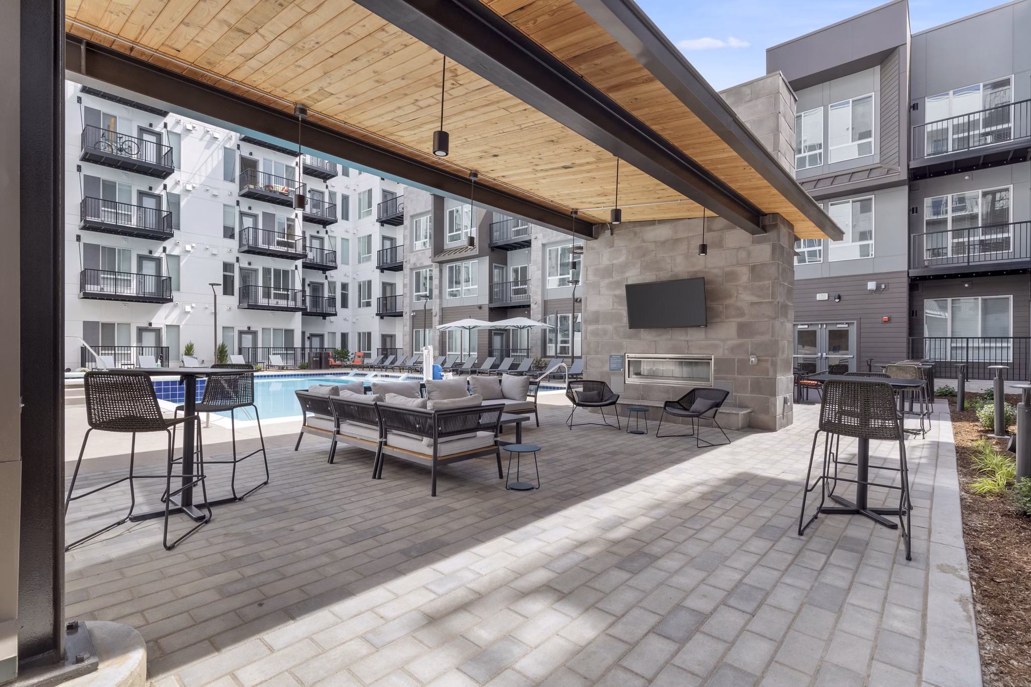 Relaxing patio with modern seating at Legacy at Fitz Apartments, ideal for enjoying outdoor moments