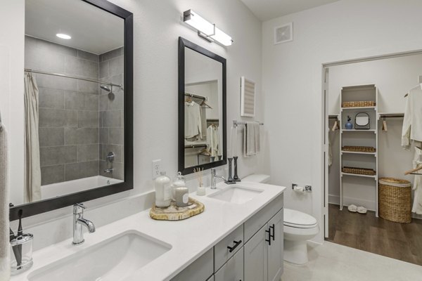 Luxurious bathroom with modern fixtures at The Grayson Apartments, Greystar luxury apartments located near convenient amenities