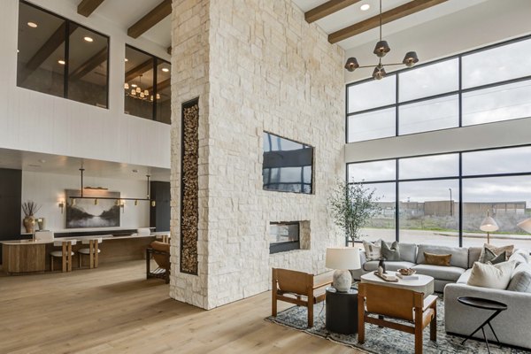 Clubhouse featuring lounge seating and pool table at The Grayson Apartments, offering luxury community spaces for residents