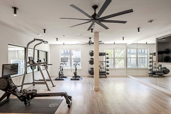 Fitness center with state-of-the-art gym equipment at The Grayson Apartments