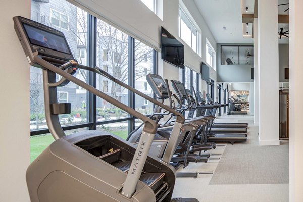 Fitness center with modern equipment at The Grayson Apartments