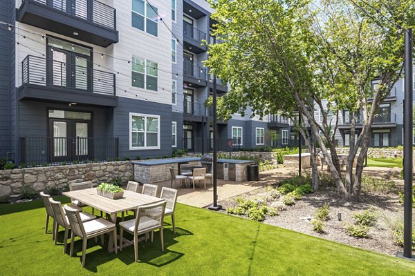 Scenic courtyard with lush greenery at The Grayson Apartments