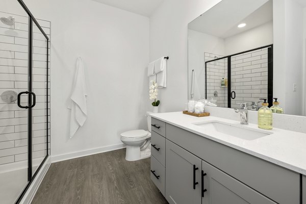 Stylish bathroom with modern fixtures at Bowery West Apartments