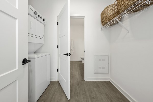 Modern bathroom featuring sleek fixtures and marble countertops at Bowery West Apartments