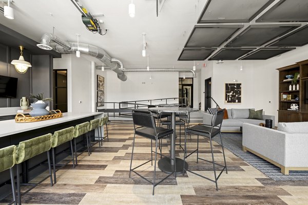 Modern clubhouse featuring stylish seating and entertainment areas at Bowery West Apartments