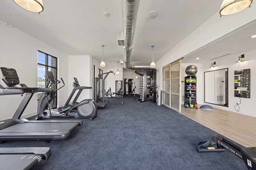 State-of-the-art fitness center with modern equipment at Bowery West Apartments, ideal for active residents seeking luxury living