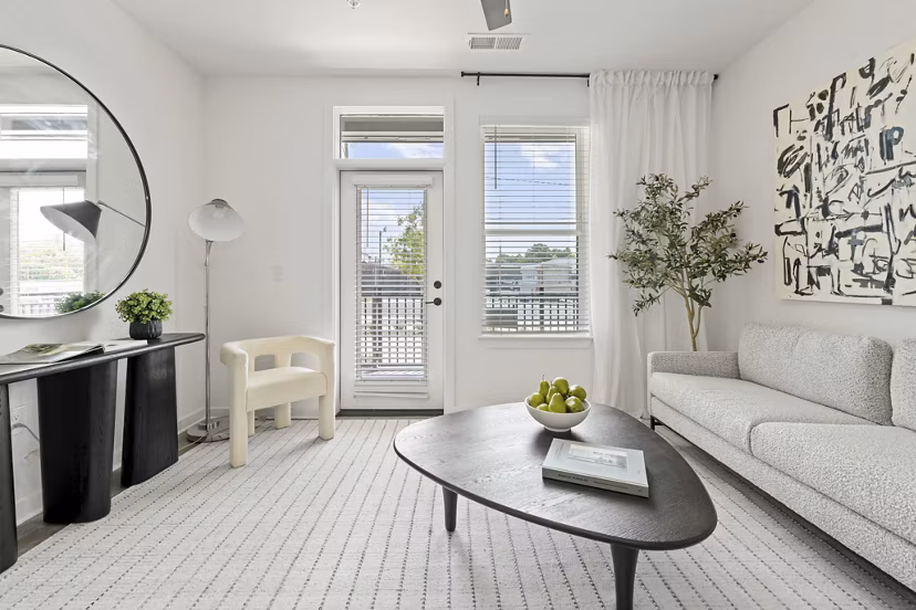 Living room designed for luxury at Bowery West Apartments featuring modern furnishings and open layout