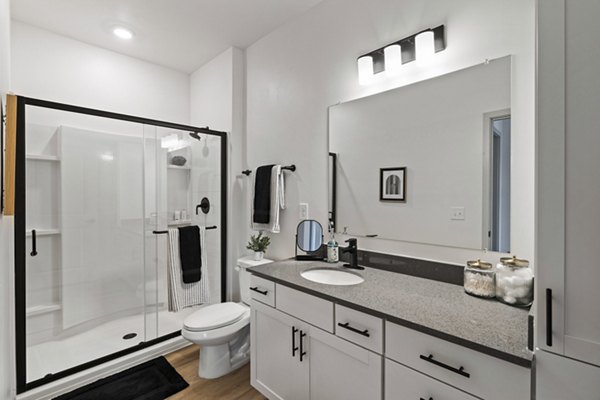 Bright bathroom featuring modern fixtures and marble countertops in The Gabriel Apartments, luxury living by Greystar