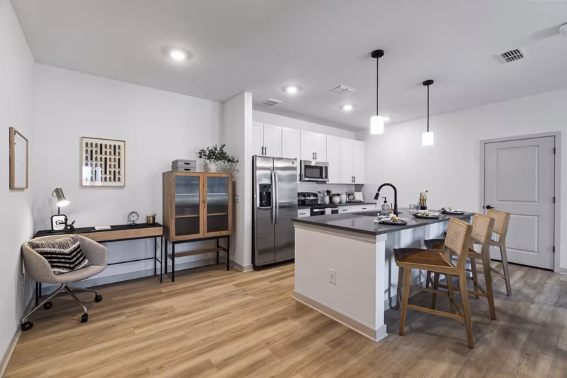 Modern kitchen with stainless steel appliances at The Gabriel Apartments luxury homes