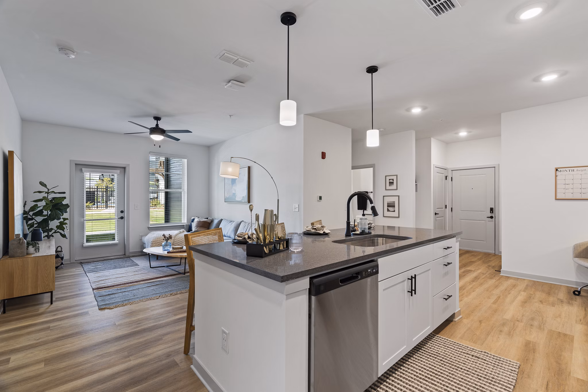 Modern kitchen featuring stainless steel appliances and quartz countertops at The Gabriel Apartments in this Greystar luxury community