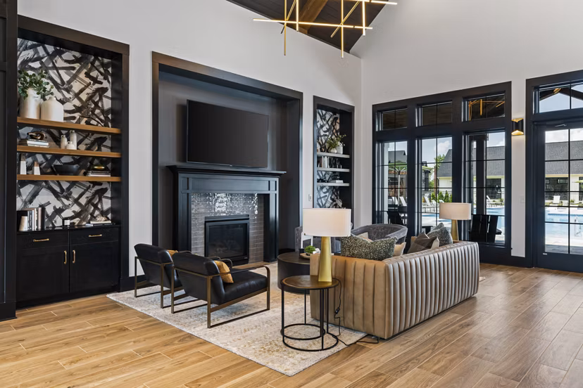 Living room with contemporary decor and ample natural light at The Gabriel Apartments, luxury rental in downtown area